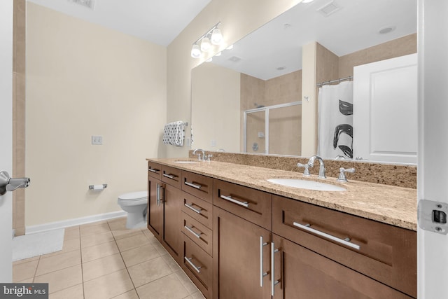 444 W Broad St Unit 407, Falls Church, VA 22046 - bathroom featuring double vanity, tile patterned floors, a shower with shower curtain, toilet, and baseboards