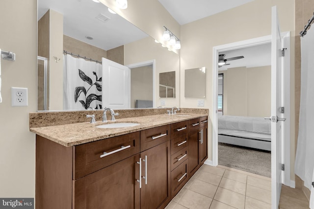 444 W Broad St Unit 407, Falls Church, VA 22046 - ensuite bathroom with double vanity, tile patterned floors, and baseboards