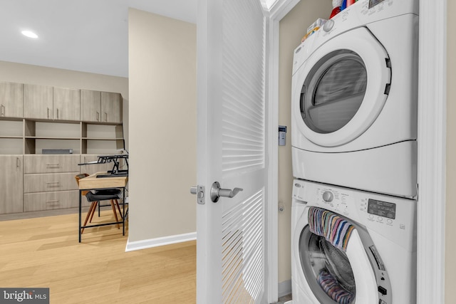 444 W Broad St Unit 407, Falls Church, VA 22046 - laundry room with estacked washer and dryer, light wood-style flooring, baseboards, and recessed lighting