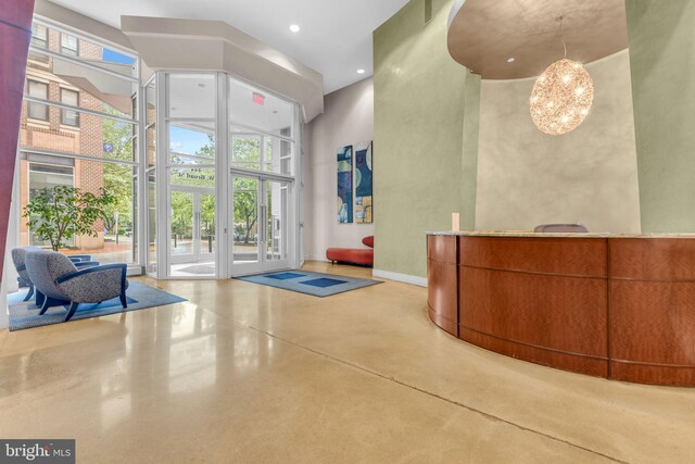444 W Broad St Unit 407, Falls Church, VA 22046 - reception with french doors, a chandelier, a towering ceiling, and recessed lighting