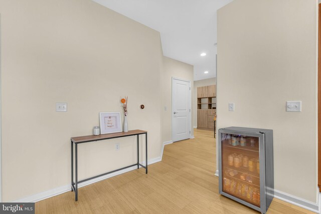 444 W Broad St Unit 407, Falls Church, VA 22046 - hall featuring wine cooler, light wood-style flooring, baseboards, and recessed lighting