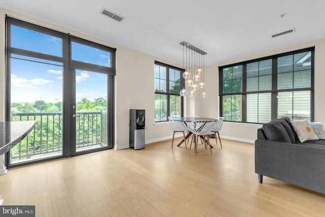 444 W Broad St Unit 407, Falls Church, VA 22046 - living room with light wood finished floors and baseboards