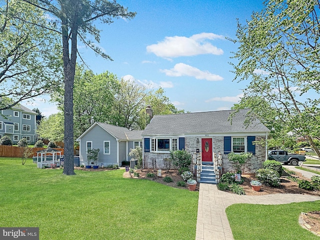 single story home with fence, a chimney, and a front lawn