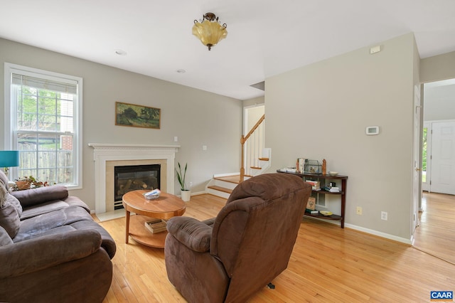 2364 N Chesterfield Ct, Charlottesville, VA 22911 - living area with stairs, light wood-type flooring, baseboards, and a high end fireplace