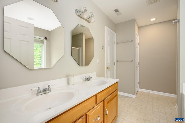 2364 N Chesterfield Ct, Charlottesville, VA 22911 - bathroom featuring tile patterned floors, double vanity, and baseboards