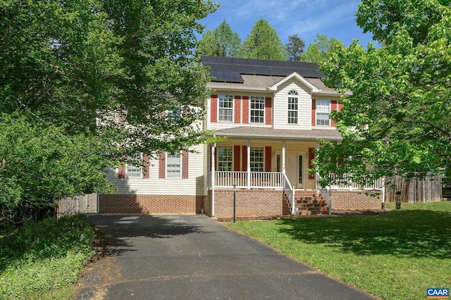 2364 N Chesterfield Ct, Charlottesville, VA 22911 - colonial inspired home featuring covered porch, roof mounted solar panels, and driveway