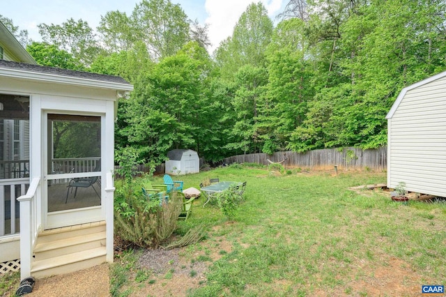2364 N Chesterfield Ct, Charlottesville, VA 22911 - view of yard featuring a storage unit, an outdoor structure, and a sunroom