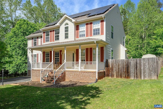 2364 N Chesterfield Ct, Charlottesville, VA 22911 - colonial home featuring covered porch, roof mounted solar panels, and stairway