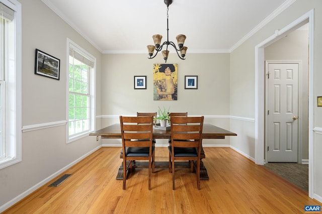 2364 N Chesterfield Ct, Charlottesville, VA 22911 - dining space with light wood finished floors, ornamental molding, a chandelier, and baseboards