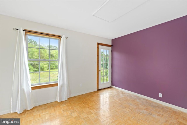 empty room with baseboards and a healthy amount of sunlight