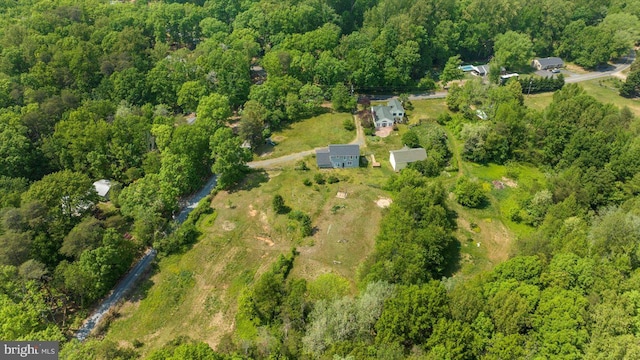 aerial view with a wooded view