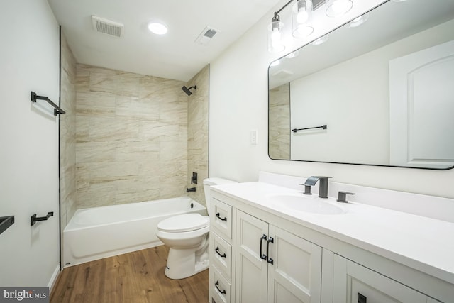 1797 Valleyside Dr, Frederick, MD 21702 - bathroom with wood finished floors, toilet, vanity, and bathtub / shower combination