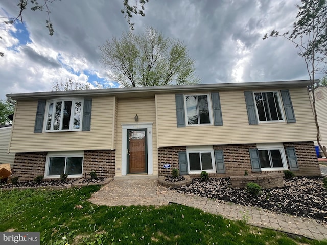 1797 Valleyside Dr, Frederick, MD 21702 - raised ranch with brick siding and a front yard