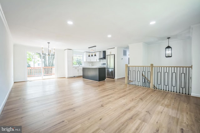 1797 Valleyside Dr, Frederick, MD 21702 - unfurnished living room featuring a chandelier, light wood-style floors, baseboards, recessed lighting, and crown molding