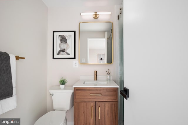 bathroom with toilet and vanity
