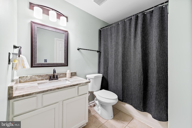 bathroom featuring tile patterned flooring, visible vents, toilet, and vanity