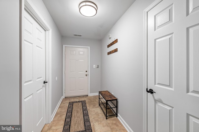 entryway with visible vents and baseboards