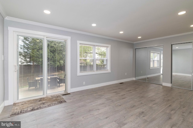 404 Crescent Rd, Hatboro, PA 19040 - unfurnished bedroom featuring crown molding, two closets, and multiple windows