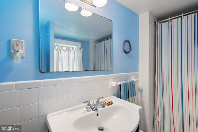 2200 Enterprise Rd, Bowie, MD 20721 - bathroom with a sink, a wainscoted wall, and tile walls