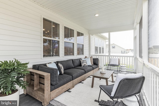 sunroom / solarium featuring an outdoor hangout area