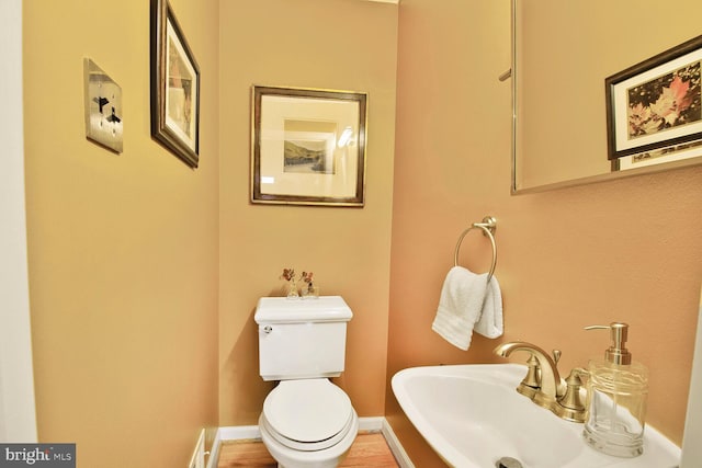 bathroom featuring toilet