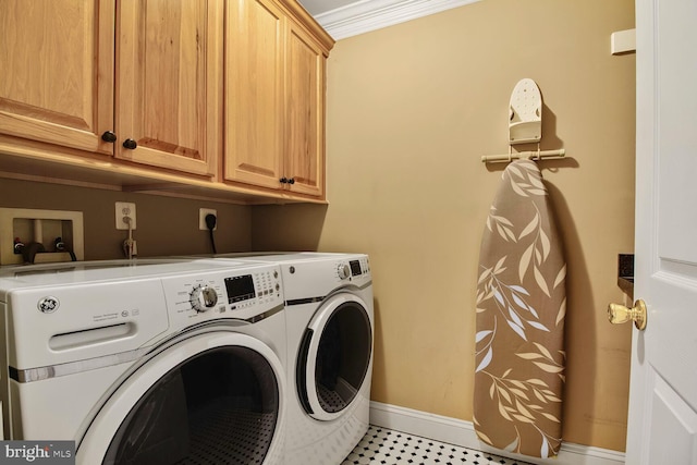 laundry room with baseboards, independent washer and dryer, and cabinet space