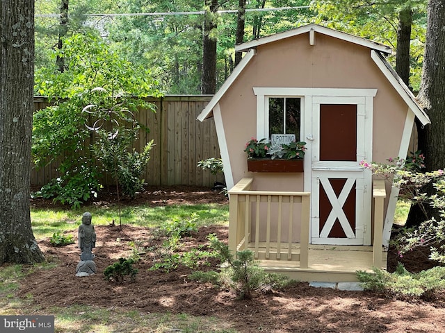 view of shed with fence