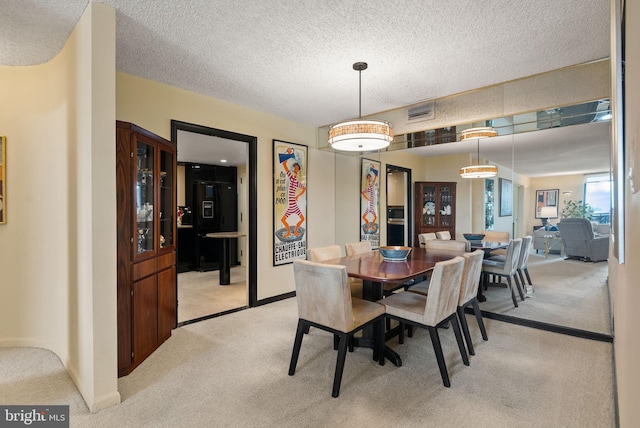 1101 S Arlington Ridge Rd Unit 1107, Arlington, VA 22202 - dining room with light carpet, a textured ceiling, and baseboards