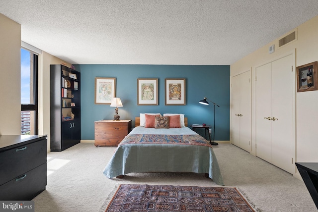 1101 S Arlington Ridge Rd Unit 1107, Arlington, VA 22202 - bedroom featuring carpet, multiple windows, and a textured ceiling