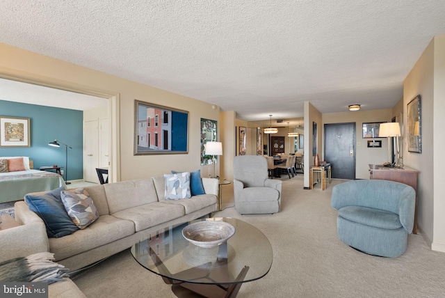 1101 S Arlington Ridge Rd Unit 1107, Arlington, VA 22202 - living area featuring carpet floors, a textured ceiling, and a chandelier