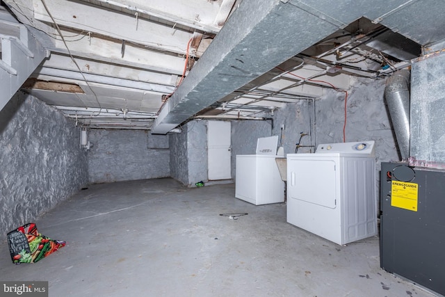 unfinished basement featuring separate washer and dryer