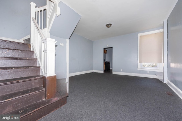 stairs with baseboards, carpet floors, and visible vents