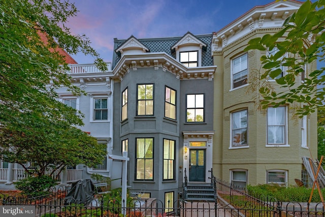 418 Seward Sq SE Unit 3, Washington, DC 20003 - view of front facade with a fenced front yard, stucco siding, and entry steps