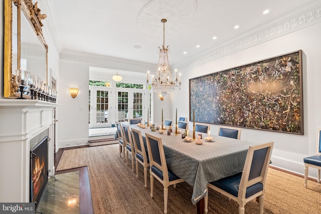 304 S Saint Asaph St, Alexandria, VA 22314 - dining room with ornamental molding, baseboards, a fireplace with flush hearth, french doors, and a chandelier