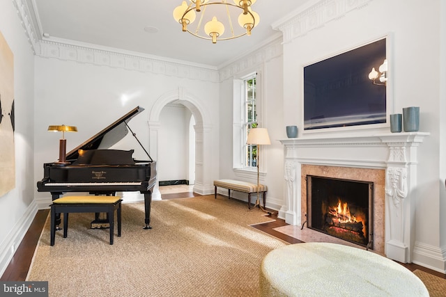 304 S Saint Asaph St, Alexandria, VA 22314 - living area featuring a chandelier, a fireplace, wood finished floors, and crown molding