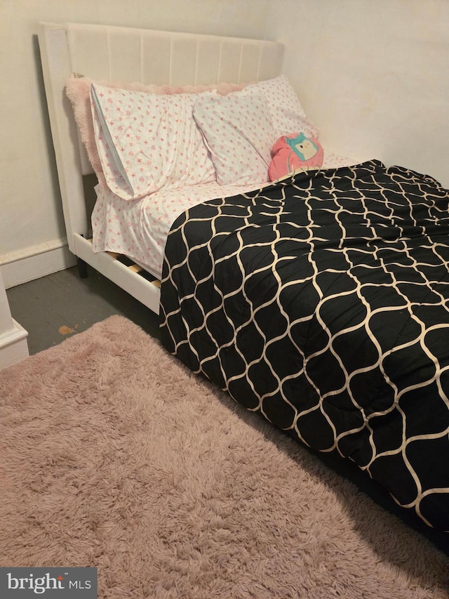 bedroom featuring baseboards