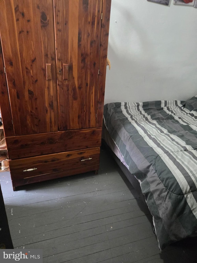 bedroom with wood-type flooring