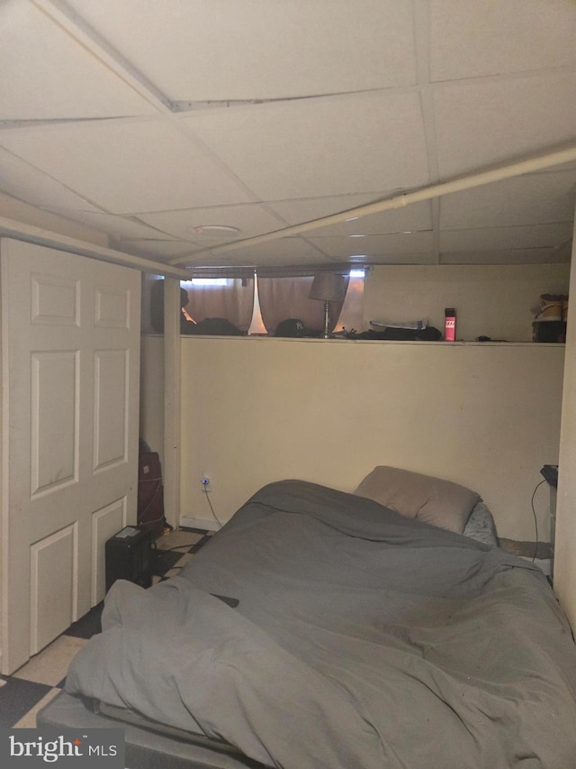 bedroom with a paneled ceiling