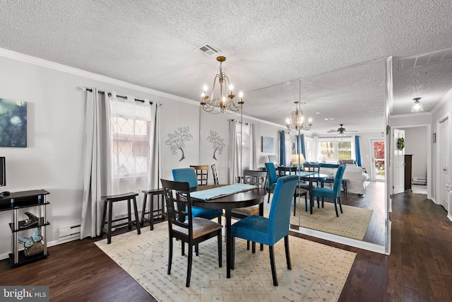 54 Dogwood Rd, Manahawkin, NJ 08050 - dining space featuring ornamental molding, visible vents, a textured ceiling, and wood finished floors
