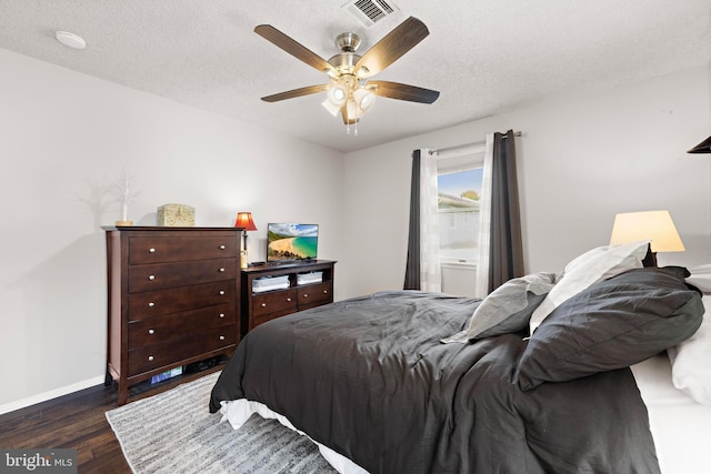 54 Dogwood Rd, Manahawkin, NJ 08050 - bedroom featuring baseboards, dark wood finished floors, visible vents, and a textured ceiling