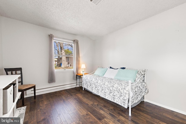 54 Dogwood Rd, Manahawkin, NJ 08050 - bedroom featuring a baseboard radiator, a textured ceiling, baseboards, visible vents, and wood-type flooring