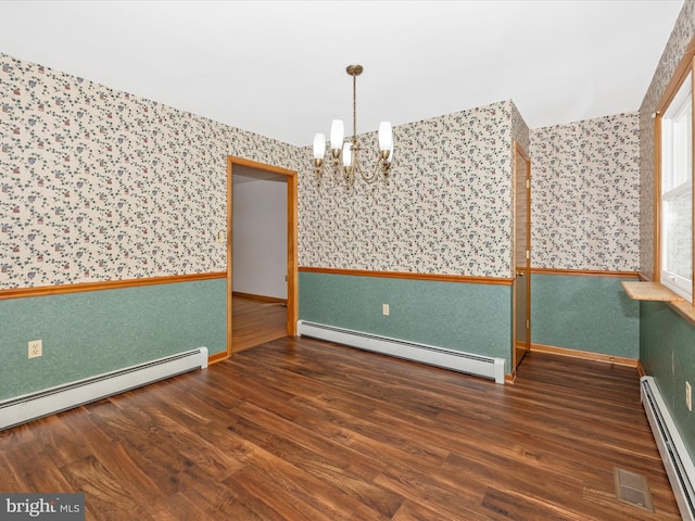 9203 Oak Tree Cir, Frederick, MD 21701 - spare room featuring visible vents, wallpapered walls, a baseboard heating unit, a chandelier, and a baseboard radiator
