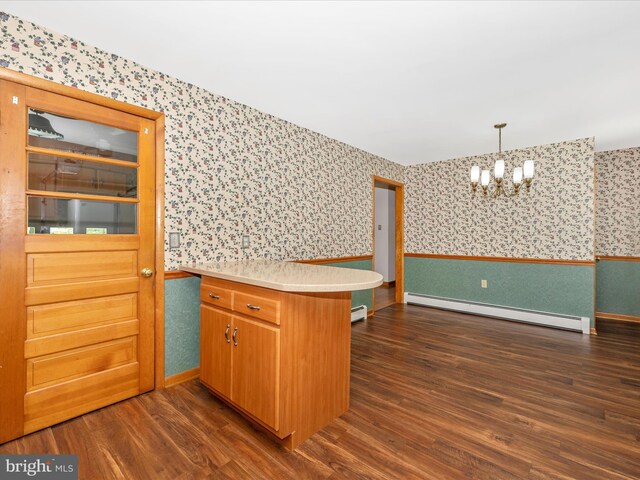 9203 Oak Tree Cir, Frederick, MD 21701 - kitchen with dark wood-style flooring, wallpapered walls, an inviting chandelier, and baseboard heating