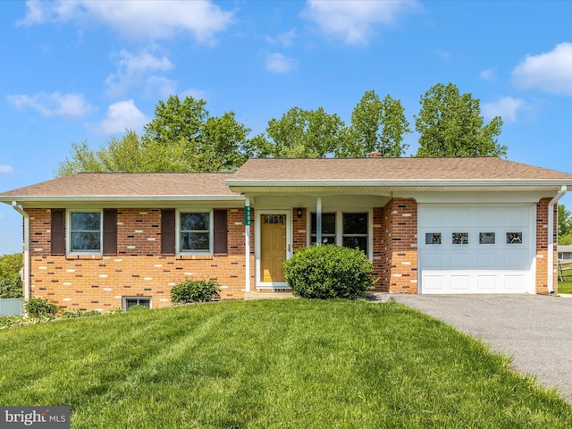 9203 Oak Tree Cir, Frederick, MD 21701 - ranch-style home with a garage, a front yard, brick siding, a shingled roof, and driveway