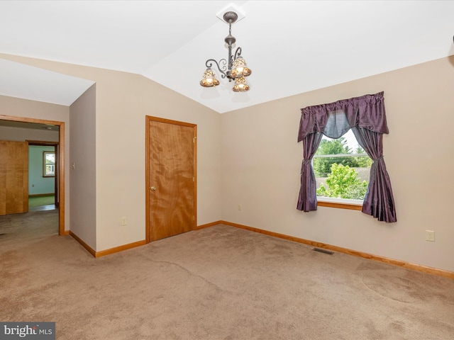 9203 Oak Tree Cir, Frederick, MD 21701 - unfurnished room with an inviting chandelier, baseboards, carpet floors, and vaulted ceiling