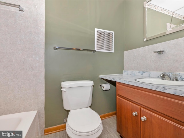 9203 Oak Tree Cir, Frederick, MD 21701 - bathroom featuring vanity, toilet, a bathtub, baseboards, and visible vents
