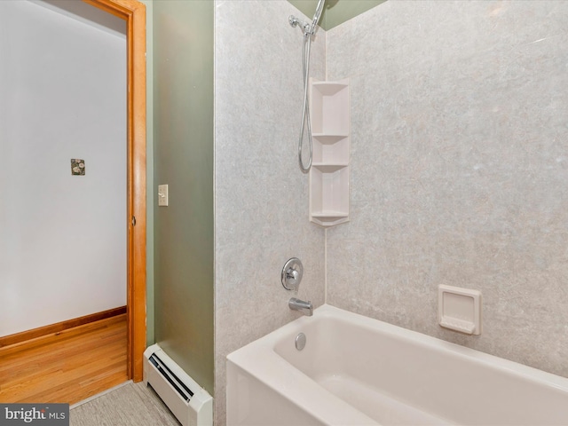 9203 Oak Tree Cir, Frederick, MD 21701 - bathroom with wood finished floors, shower / bathing tub combination, and a baseboard heating unit