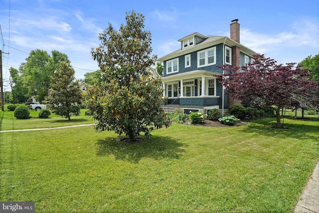view of property exterior featuring a chimney and a yard