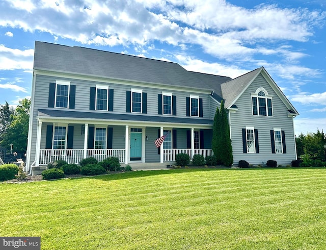 view of front of house featuring a porch and a front lawn
