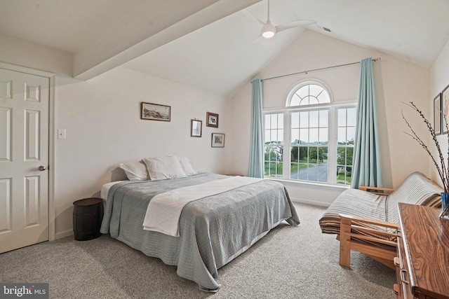 bedroom featuring carpet, baseboards, and high vaulted ceiling